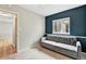 Bedroom featuring a gray sofa, neutral walls, carpeted floor and a large window at 1280 W 134Th Pl, Westminster, CO 80234
