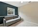 Bedroom featuring a gray sofa, neutral walls, and a carpeted floor at 1280 W 134Th Pl, Westminster, CO 80234