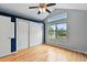Bright bedroom featuring hardwood floors, a ceiling fan and a large window for ample natural light at 1280 W 134Th Pl, Westminster, CO 80234