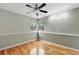 Bedroom featuring natural light, ceiling fan, neutral walls, and wood flooring at 1280 W 134Th Pl, Westminster, CO 80234