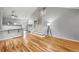 Bright living room with hardwood floors, vaulted ceilings, and a staircase at 1280 W 134Th Pl, Westminster, CO 80234