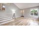 Bright living room with hardwood floors, vaulted ceilings, and a staircase at 1280 W 134Th Pl, Westminster, CO 80234