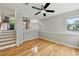 Hardwood floors in living room, kitchen in background at 1280 W 134Th Pl, Westminster, CO 80234