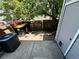 Backyard with a small deck and a gate leading to a fenced yard with a car in view at 10716 Foxwood Ct, Parker, CO 80138