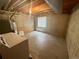Unfinished basement space with concrete floor, water heater, and washer hookups at 10716 Foxwood Ct, Parker, CO 80138