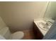 Bathroom featuring a sink and toilet at 10716 Foxwood Ct, Parker, CO 80138