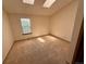 Bright carpeted bedroom featuring a window and neutral walls at 10716 Foxwood Ct, Parker, CO 80138