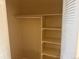 Empty closet with white walls and shelving for organization at 10716 Foxwood Ct, Parker, CO 80138