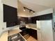 Kitchen featuring dark cabinets and a stainless steel oven at 10716 Foxwood Ct, Parker, CO 80138