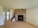 Living room featuring a stone fireplace, hardwood floors, and stairs at 10716 Foxwood Ct, Parker, CO 80138