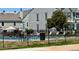 Community pool surrounded by a black fence and lounge chairs for relaxation at 10716 Foxwood Ct, Parker, CO 80138