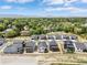 Panoramic aerial view of a neighborhood featuring modern homes nestled among mature trees and scenic landscapes at 5970 S Platte Canyon Dr, Littleton, CO 80123
