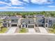 Expansive aerial view of stylish homes in a vibrant neighborhood with lush green spaces under blue skies at 5970 S Platte Canyon Dr, Littleton, CO 80123