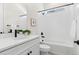 Elegant bathroom featuring a tub with tile, black fixtures, and a vanity at 5970 S Platte Canyon Dr, Littleton, CO 80123