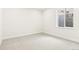 Basement bedroom offers natural light and neutral carpet at 5970 S Platte Canyon Dr, Littleton, CO 80123