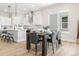 Open concept kitchen and dining area with an island, stainless appliances, and seating for six at 5970 S Platte Canyon Dr, Littleton, CO 80123