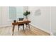 Stylish home office featuring wood floors, a modern desk, chair, and natural light at 5970 S Platte Canyon Dr, Littleton, CO 80123