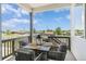 Relaxing covered outdoor patio area with seating and pleasant views of the neighborhood at 5970 S Platte Canyon Dr, Littleton, CO 80123