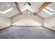 Bedroom featuring hardwood beams, a ceiling fan, and skylights at 12570 W 60Th Ave, Arvada, CO 80004
