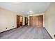 Bedroom featuring hardwood doors and trim and neutral walls at 12570 W 60Th Ave, Arvada, CO 80004
