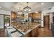 Stunning kitchen features granite counters, stone backsplash, stainless appliances, and center island at 12570 W 60Th Ave, Arvada, CO 80004