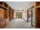 Home office featuring a built-in bookcase, with a sliding door to the backyard at 12570 W 60Th Ave, Arvada, CO 80004