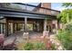 Expansive brick patio with stone pillars and access to outdoor spaces at 12570 W 60Th Ave, Arvada, CO 80004