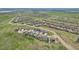 High aerial view of a sprawling residential community nestled amidst green landscapes at 8803 Antero Ct, Arvada, CO 80007