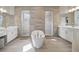 Spa-like bathroom with standalone tub, dual vanities, and a contemporary, luxurious design at 8803 Antero Ct, Arvada, CO 80007