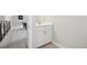 Contemporary bathroom with undermount sink and access to the living area at 8803 Antero Ct, Arvada, CO 80007