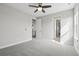 This spacious bedroom features neutral paint and carpet, ceiling fan, and two closets at 8803 Antero Ct, Arvada, CO 80007