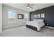 Modern bedroom with large windows and a stylish accent wall at 8803 Antero Ct, Arvada, CO 80007