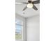 Cozy bedroom featuring a ceiling fan and a window with mountain views at 8803 Antero Ct, Arvada, CO 80007