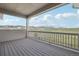 Relax on this covered deck with views of lush green landscapes and stunning mountain views at 8803 Antero Ct, Arvada, CO 80007