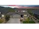 Charming two-story home with mountain views, well-manicured lawn, and welcoming front porch at 8803 Antero Ct, Arvada, CO 80007