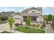 Charming front exterior of a two-story home with a well-manicured lawn and landscaping at 8803 Antero Ct, Arvada, CO 80007