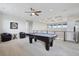 Spacious game room with a pool table and comfortable seating at 8803 Antero Ct, Arvada, CO 80007