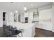 Bright kitchen with white cabinets, stainless appliances, and a large central island at 8803 Antero Ct, Arvada, CO 80007