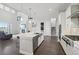 Open-concept living space featuring modern kitchen, and a large, connecting living room space at 8803 Antero Ct, Arvada, CO 80007