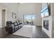 Cozy living room with fireplace, comfortable seating, and sliding glass doors to outdoor area at 8803 Antero Ct, Arvada, CO 80007