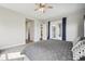 Bright main bedroom with ceiling fan, French doors, and a tranquil, comfortable design at 8803 Antero Ct, Arvada, CO 80007