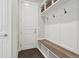 Welcoming mudroom with bench, hooks, and storage shelves for organization at 8803 Antero Ct, Arvada, CO 80007