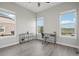 Inviting home office with large windows, ample sunlight, and a clean, modern aesthetic at 8803 Antero Ct, Arvada, CO 80007