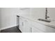 Contemporary wet bar featuring bright white cabinets, sleek hardware, and modern faucet at 8803 Antero Ct, Arvada, CO 80007