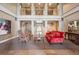 An expansive lobby with high ceilings, multiple balconies and comfortable seating arrangements at 300 Hudson St # 109, Denver, CO 80220