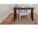 Small, rustic desk with an upholstered chair over a large jute area rug at 300 Hudson St # 109, Denver, CO 80220