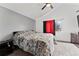 This bedroom features vaulted ceilings, neutral paint and carpet, and a light-filled window at 12119 Forest St, Thornton, CO 80241