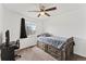 Bright bedroom with a ceiling fan, neutral paint, and a light-filled window at 12119 Forest St, Thornton, CO 80241