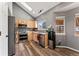 Modern kitchen featuring stainless steel appliances, granite countertops, and a skylight for natural light at 12119 Forest St, Thornton, CO 80241
