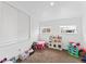 Bright playroom featuring neutral carpet, natural light, and fun toys at 12119 Forest St, Thornton, CO 80241